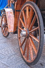 Wooden wheels on an old carriage.