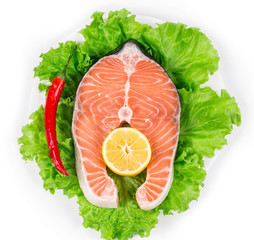 Fresh salmon steak with pepper and lemon.