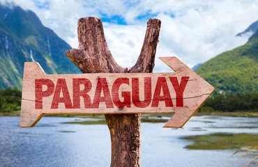 Poster Paraguay wooden sign with mountains background © gustavofrazao
