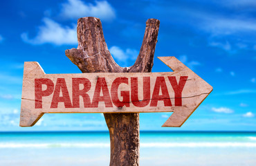 Paraguay wooden sign with lake background