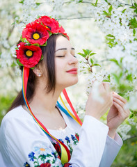 girl in national dress enjoying spring