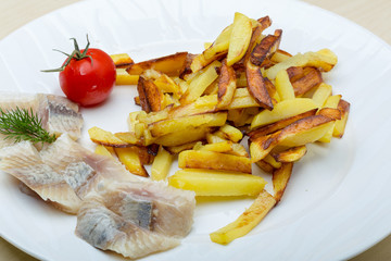 Roasted potato with herring fillet