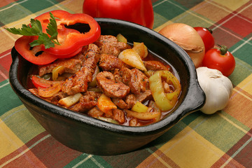 Coked pork meat with peppers