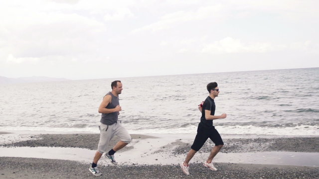 Two man jogging on the beach
