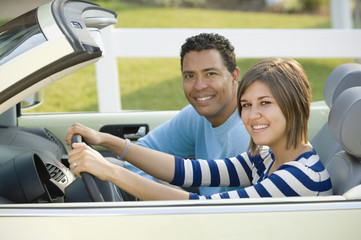Hispanic father and daughter in car