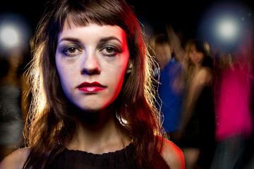 Disheveled drunk or female high on drugs at a nightclub
