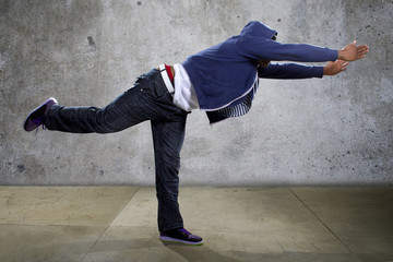 young black male dancing hip hop style in an urban setting