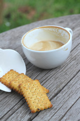 latte coffee in glass and crackers