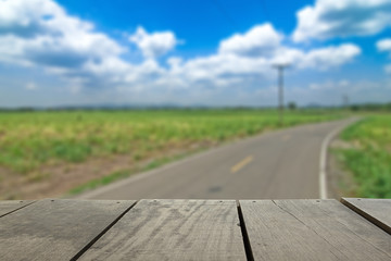 Defocused and blur image of terrace wood and road scenery view