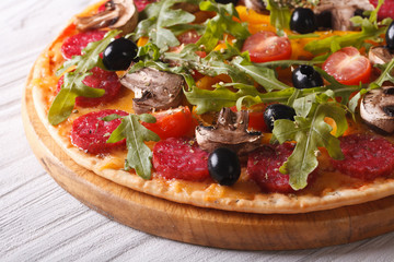 Delicious pizza with herbs, vegetables and salami horizontal

