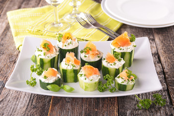 canape with cucumber,cheese and salmon