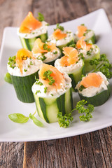canape with cucumber,cheese and salmon