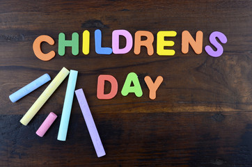 Happy Childrens Day concept with colorful play letters.