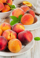 fresh peaches on a wooden table