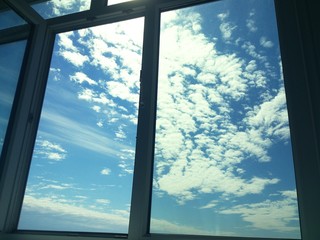 Blu sky and clouds in the window