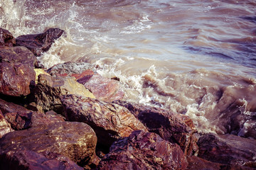 Fototapeta na wymiar Sea and rock with filter effect retro vintage style