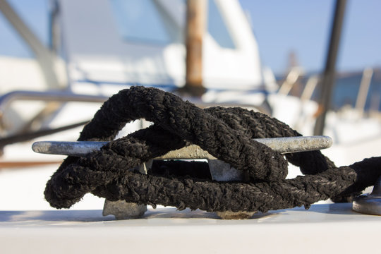 Little boat bollard with black marine cord node