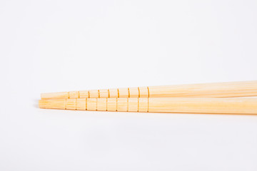 chopsticks on a white paper background