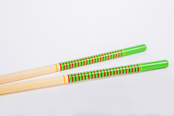 chopsticks on a white paper background