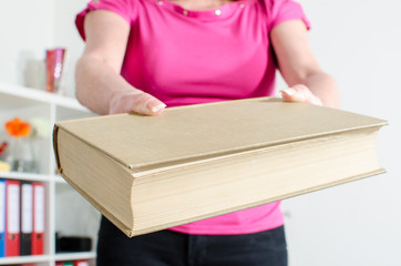 Woman hand holding a book