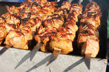 Pieces of meat cooked on fire