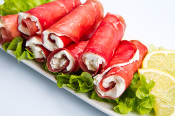 Dried beef and cheese on white dish