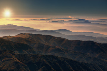 View from the mountain peak above the clouds
