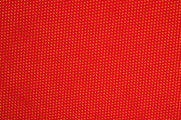 Red nonwoven fabric on a yellow