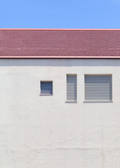 Detail of house exterior wall and window.