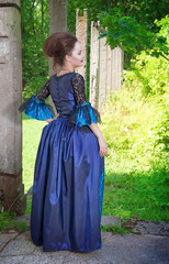 Beautiful young  woman in blue medieval dress