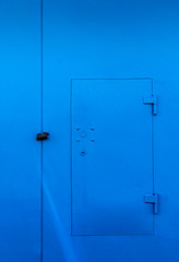 Bright Blue Locked Door and Padlock