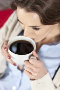 Woman enjoying fresh coffee