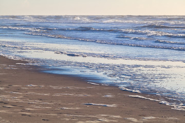 North sea storm and sand beach