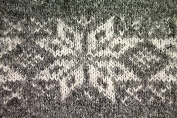 background gray knitted jacquard pattern closeup