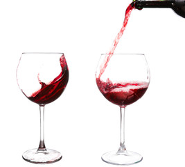 Red wine pouring on white background