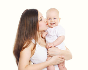 Young mother holding on hands and kissing her cute baby