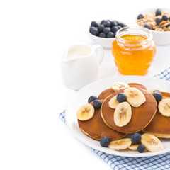 breakfast - pancakes with banana and blueberries, yogurt 