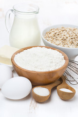 milk, cereal and ingredients for baking, vertical