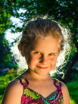 Little girl/ Face portrait little girl in backlight