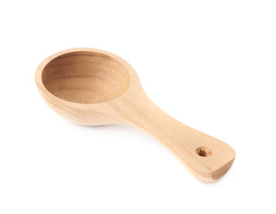 Small wooden measure spoon isolated