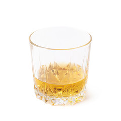 Glass tumbler filled with whiskey isolated