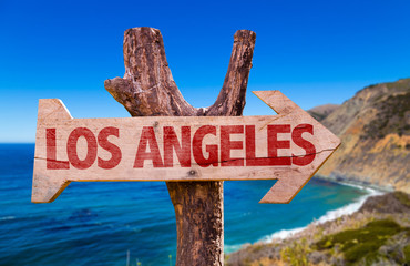 Los Angeles wooden sign with coast background