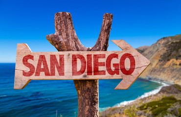 San Diego wooden sign with coast background