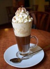 Viennese coffee in glass cup with whipped cream