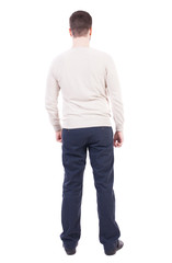 Back view of man in jeans.