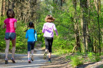 Fototapeta premium Family sport, mother and kids jogging outdoors 