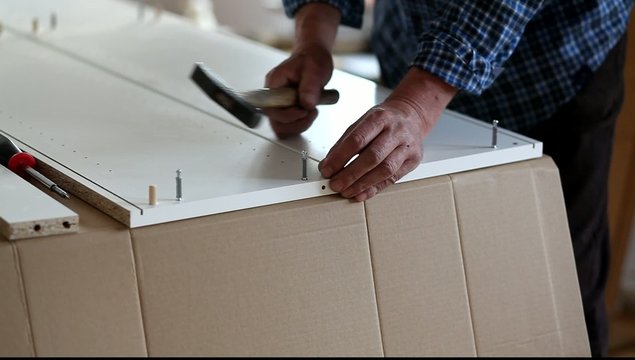 Man Assembling Flat Pack Furniture