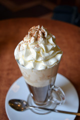 Viennese coffee in glass cup with whipped cream