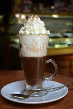 Viennese coffee in glass cup with whipped cream