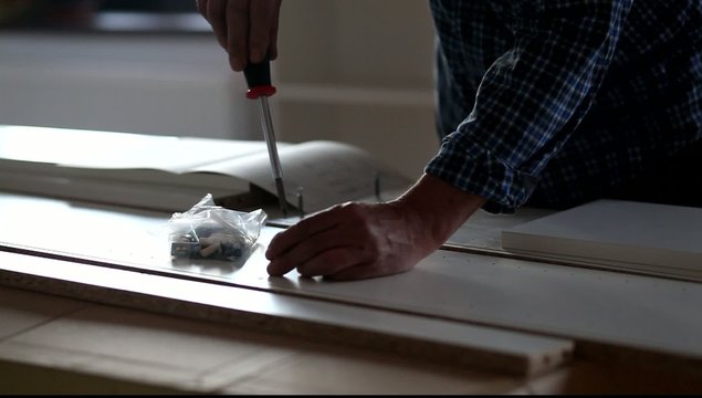 Man Assembling Flat Pack Furniture